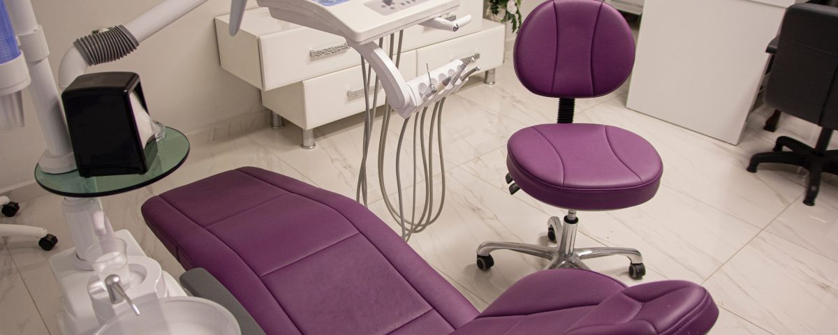 Dental office with purple dental chairs
