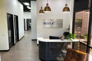 Reception desk with plaque that reads "Boss Advisors"