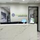 Reception desk with wall sign that reads Camelback Orthodontic Studio