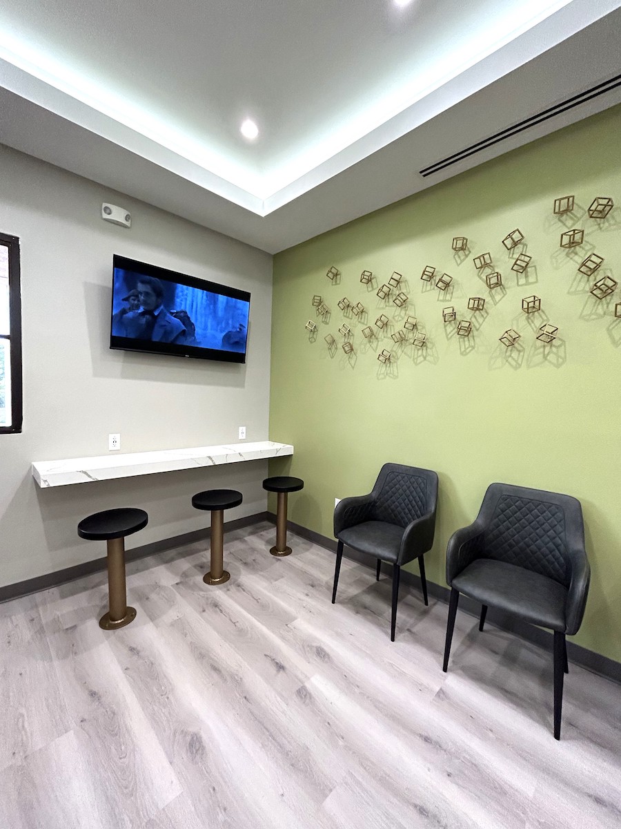 Dental office waiting room with three stools and two chairs