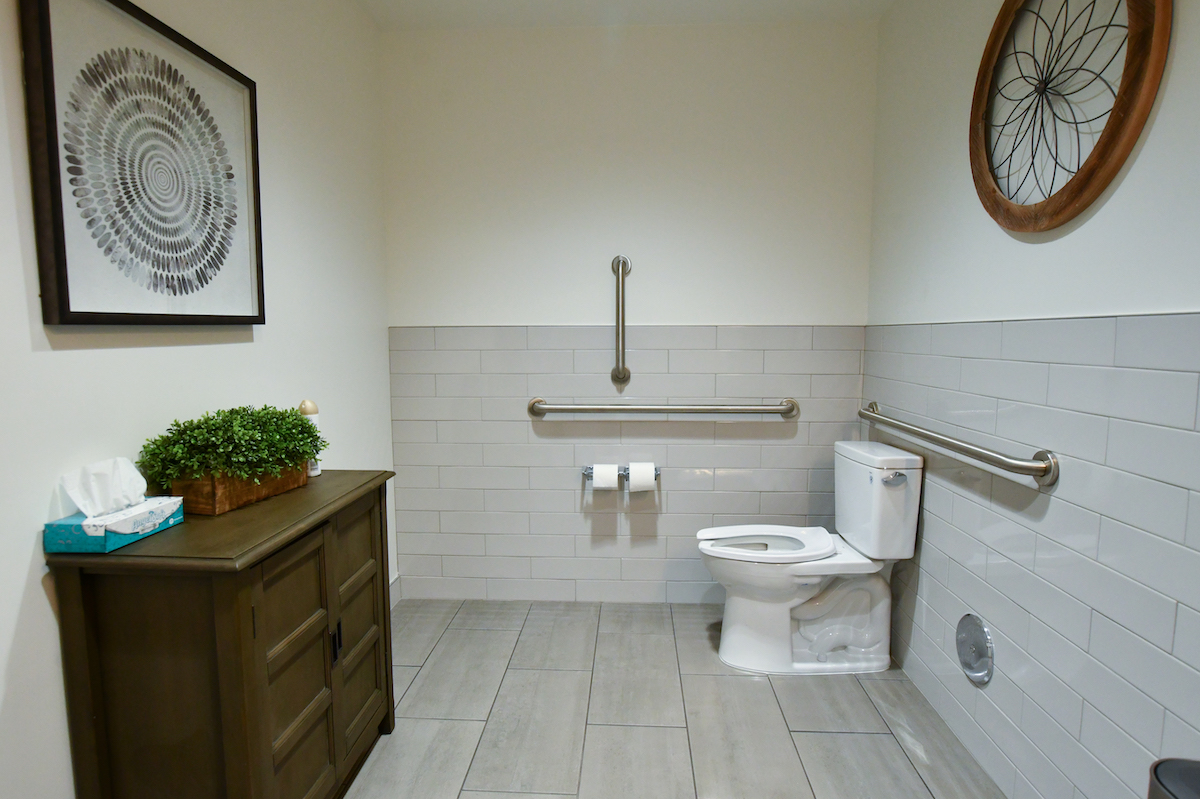 Bathroom with toilet and cabinet