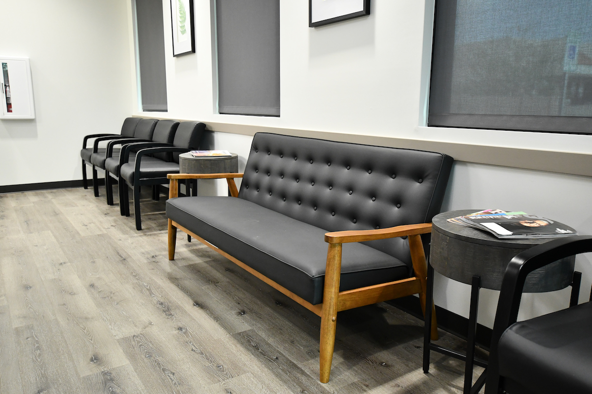 Waiting area of dental office with leather bench