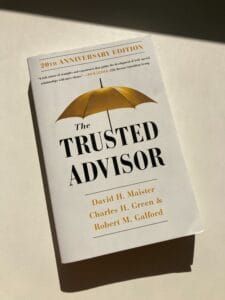 White book with golden umbrella and text The Trusted Advisor