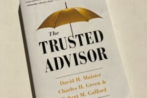 White book with golden umbrella and text The Trusted Advisor