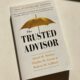 White book with golden umbrella and text The Trusted Advisor